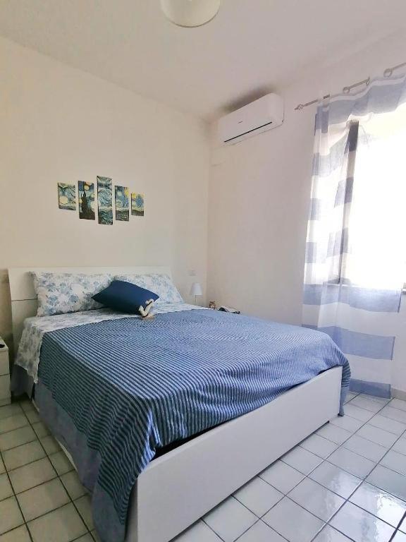 Postel nebo postele na pokoji v ubytování B&B Orizzonte Blu