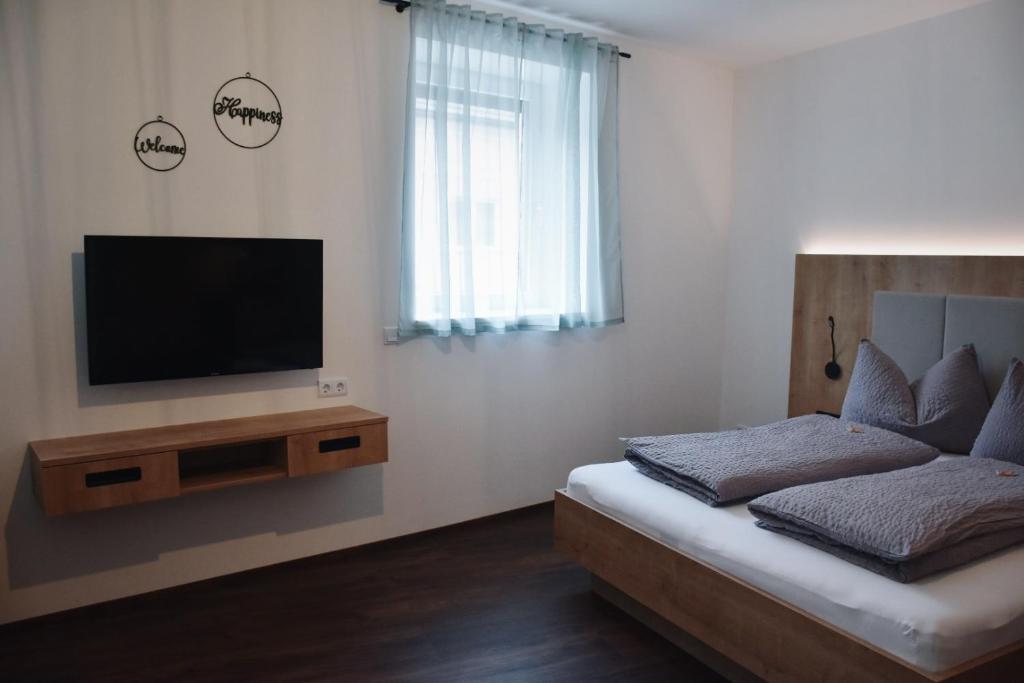 Postel nebo postele na pokoji v ubytování Das Joes Frühstückspension