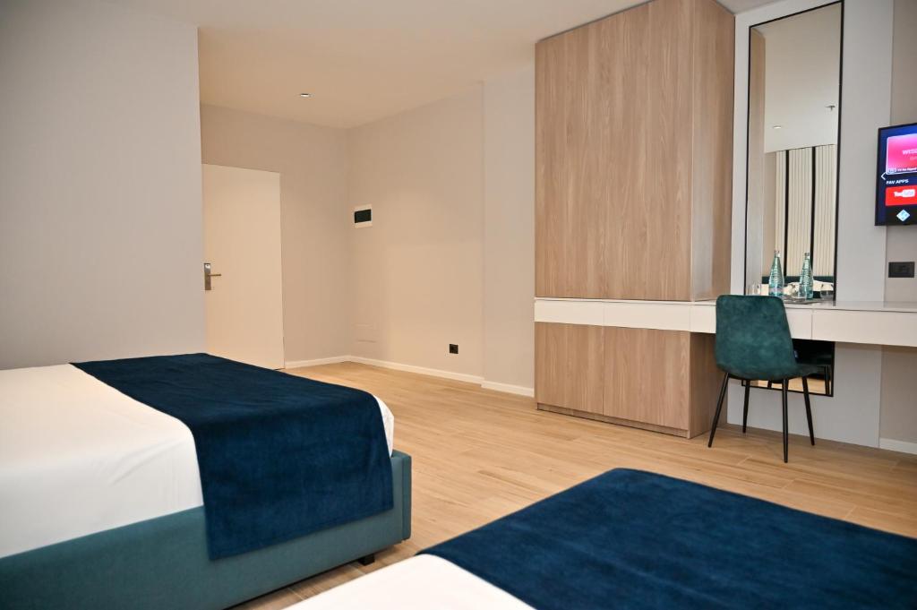 Postel nebo postele na pokoji v ubytování Hotel Vino