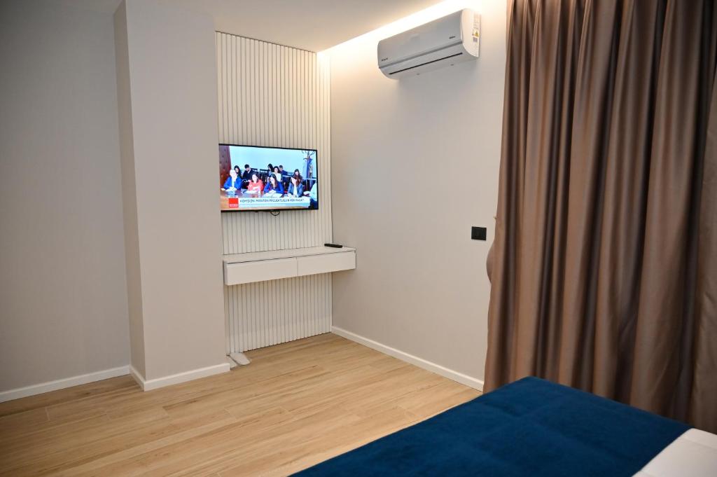 TV a/nebo společenská místnost v ubytování Hotel Vino
