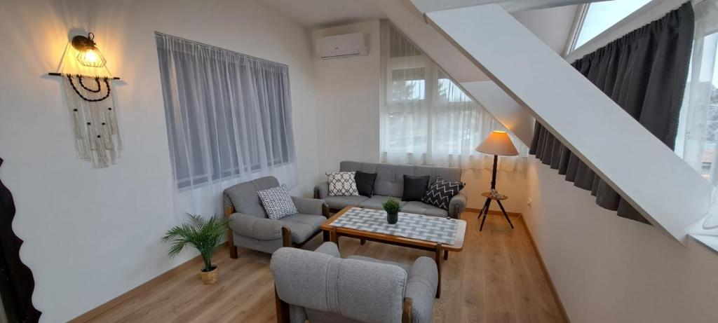Posezení v ubytování Babi Apartmanház