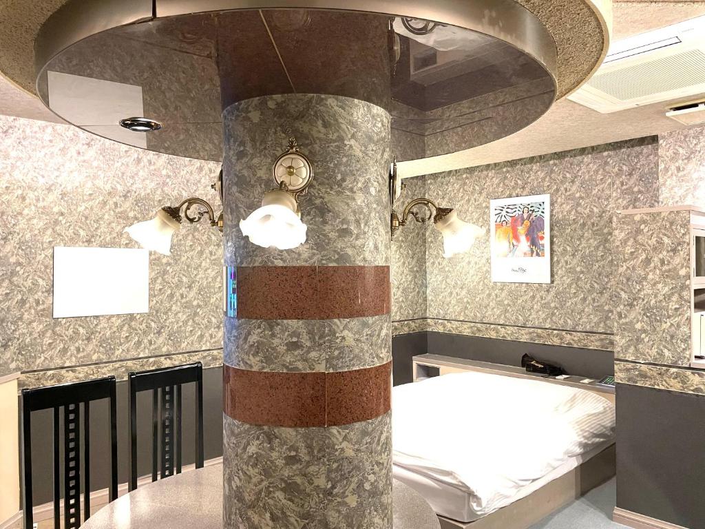 Postel nebo postele na pokoji v ubytování Hotel Ai - coupls hotel