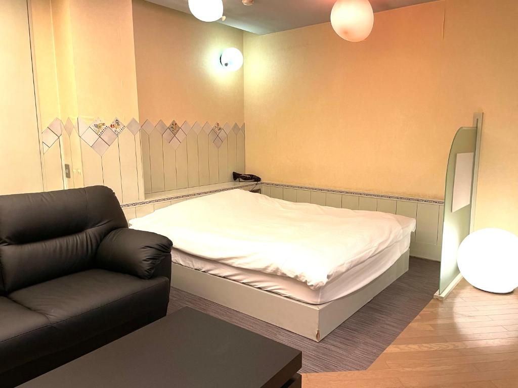 Postel nebo postele na pokoji v ubytování Hotel Ai - coupls hotel