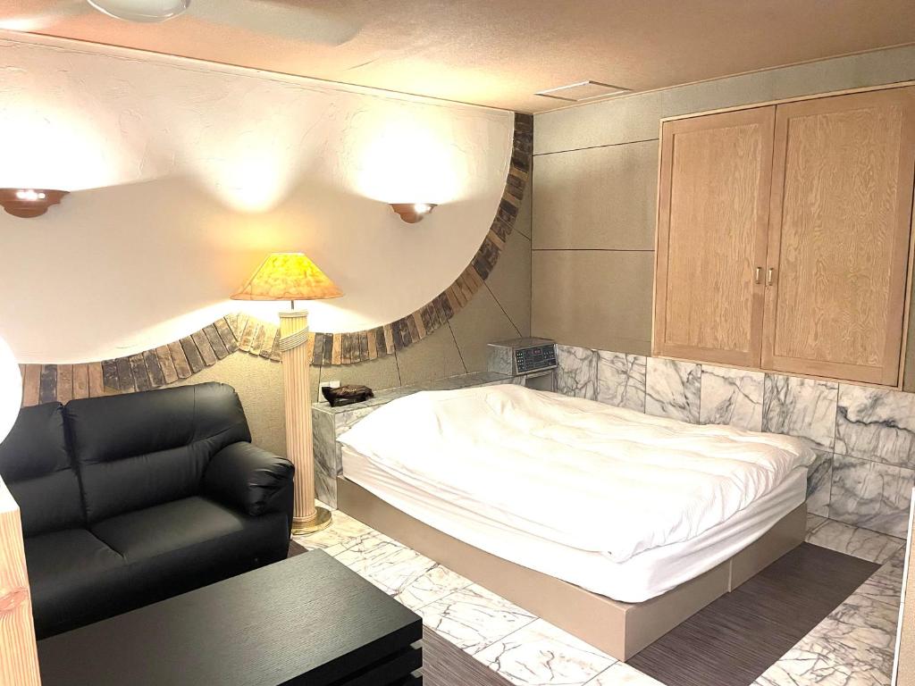 Postel nebo postele na pokoji v ubytování Hotel Ai - coupls hotel