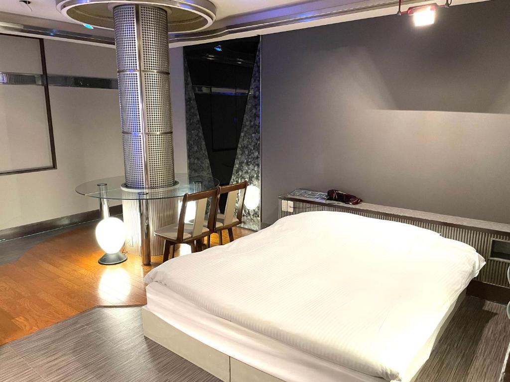 Postel nebo postele na pokoji v ubytování Hotel Ai - coupls hotel