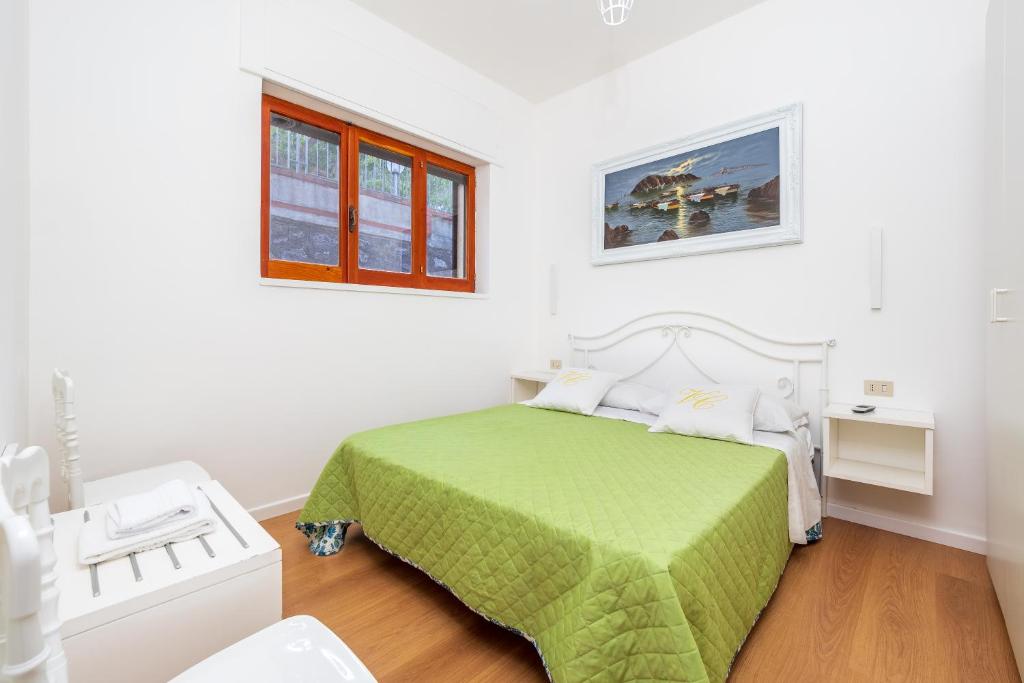 Łóżko lub łóżka w pokoju w obiekcie Villa Cristina - De Vivo Realty Piano di Sorrento
