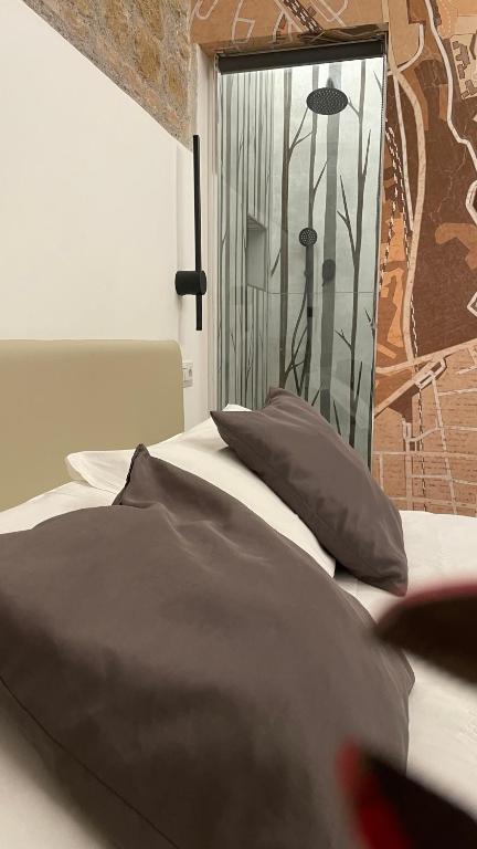 Postel nebo postele na pokoji v ubytování Hotel Felice