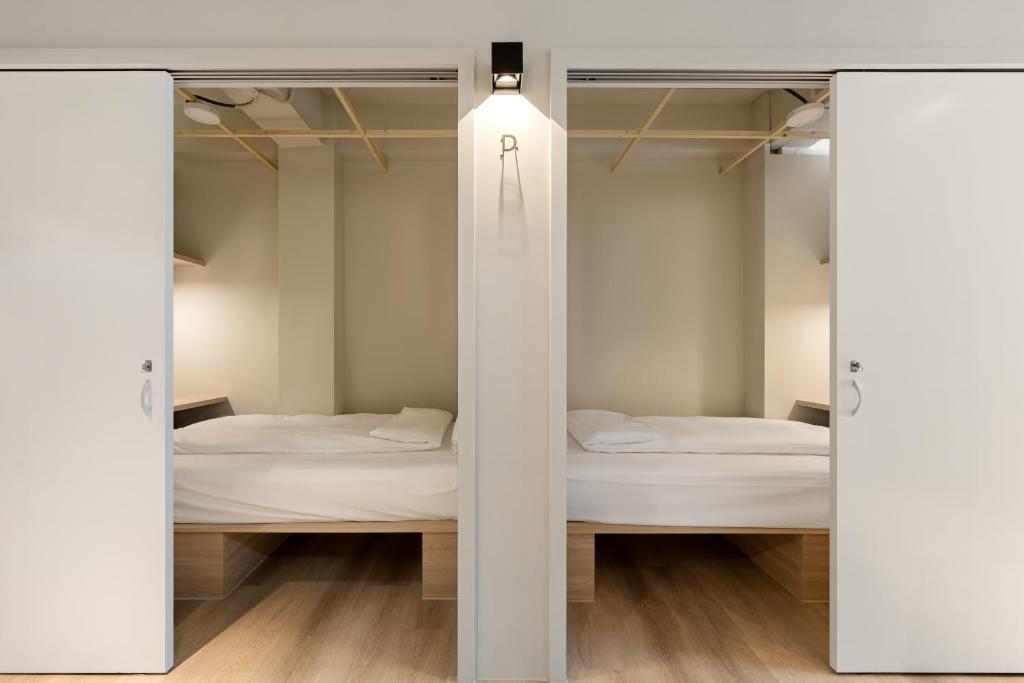Postel nebo postele na pokoji v ubytování Timios Inn 提米好旅