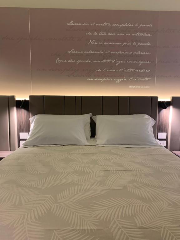 Cama ou camas em um quarto em Donna Caterina