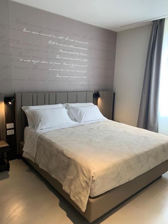 Cama ou camas em um quarto em Donna Caterina