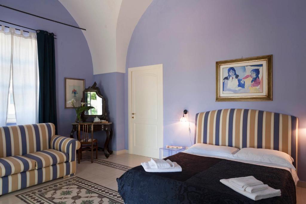 Postel nebo postele na pokoji v ubytování Villa Urso bed&breakfast