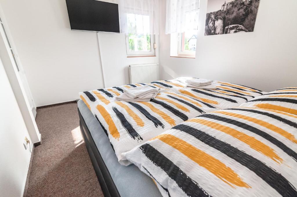 Postel nebo postele na pokoji v ubytování Penzion V Údolí