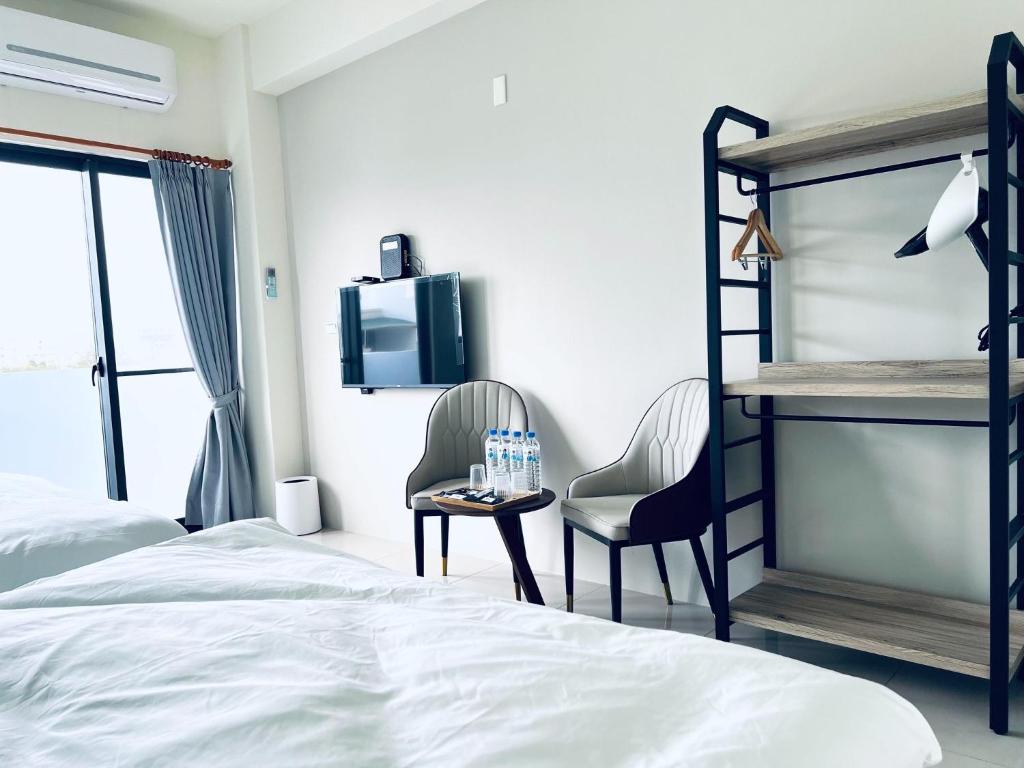 Postel nebo postele na pokoji v ubytování 秀舍民宿Showhouse