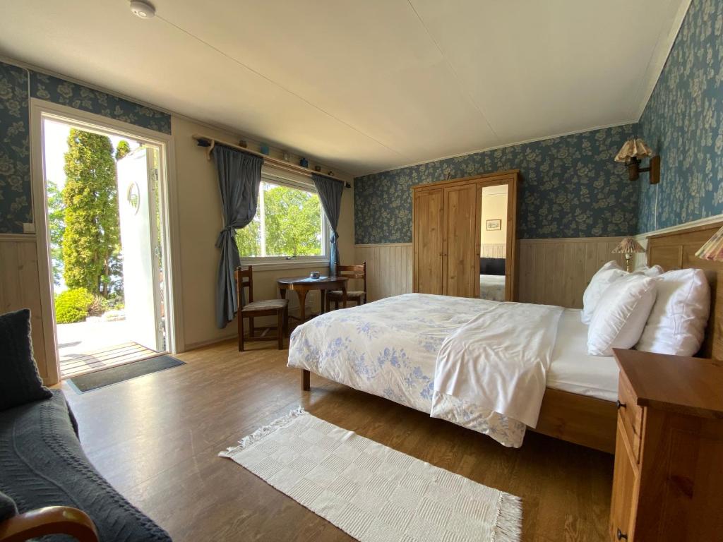 Postel nebo postele na pokoji v ubytování Bolmsö B&B