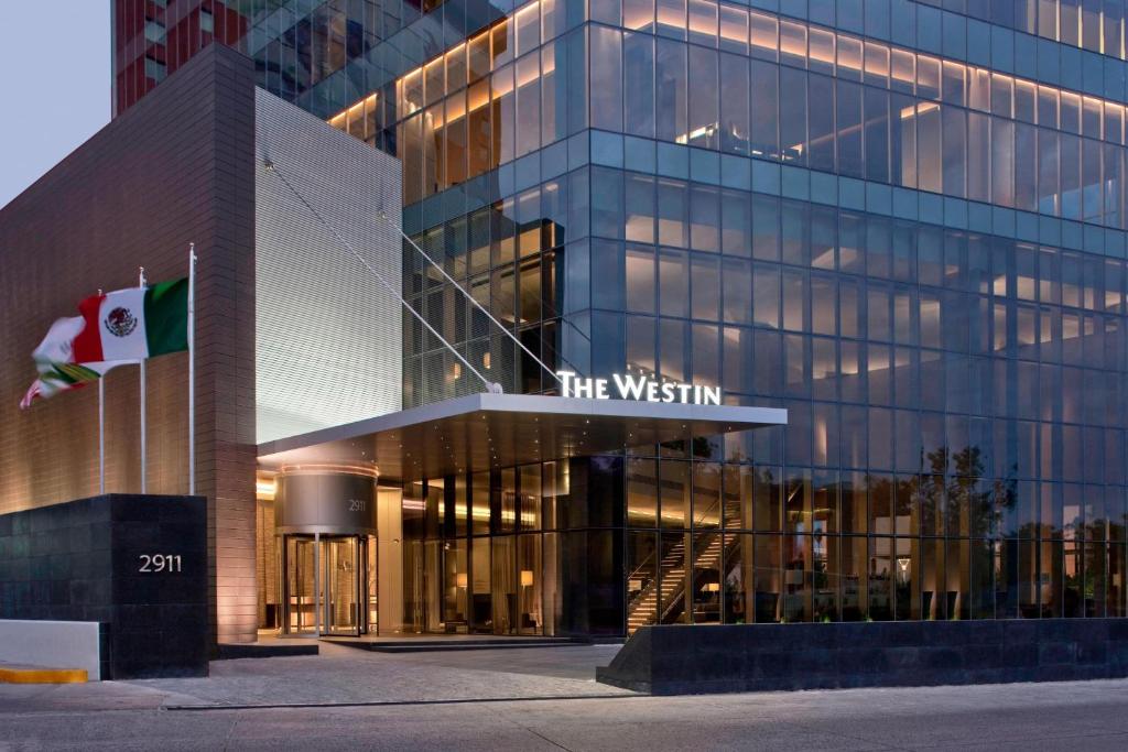 a building with a sign that reads the westin at The Westin Guadalajara in Guadalajara