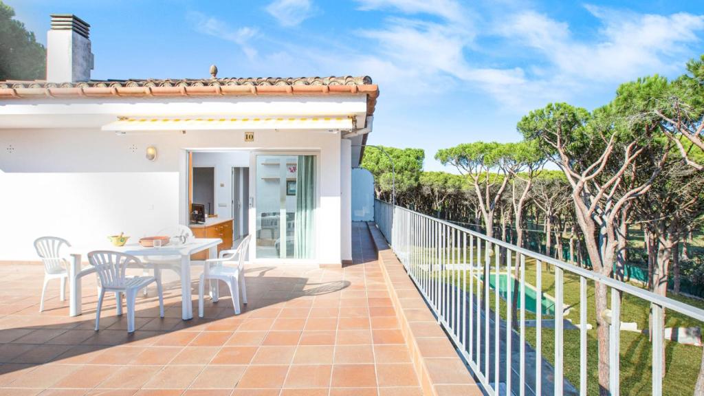 a view from the balcony of a house with a table and chairs at Mas Vermey nº 10 in Palafrugell