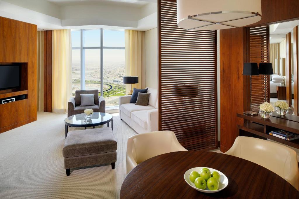 a living room with a couch and a table at JW Marriott Marquis Hotel Dubai in Dubai
