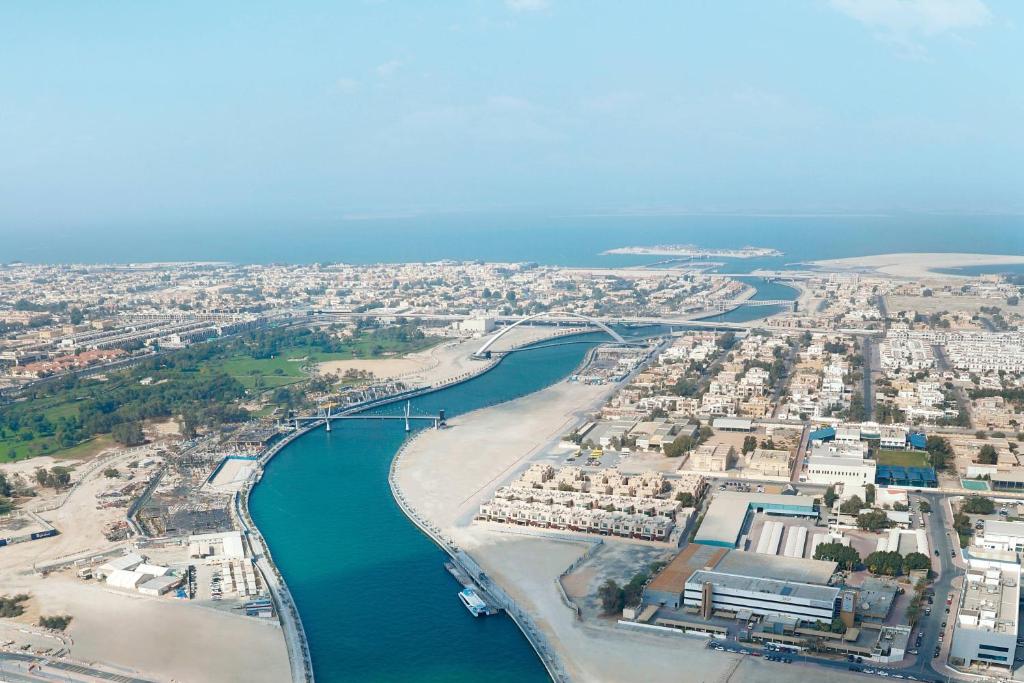 an aerial view of a beach with a bridge at JW Marriott Marquis Hotel Dubai in Dubai