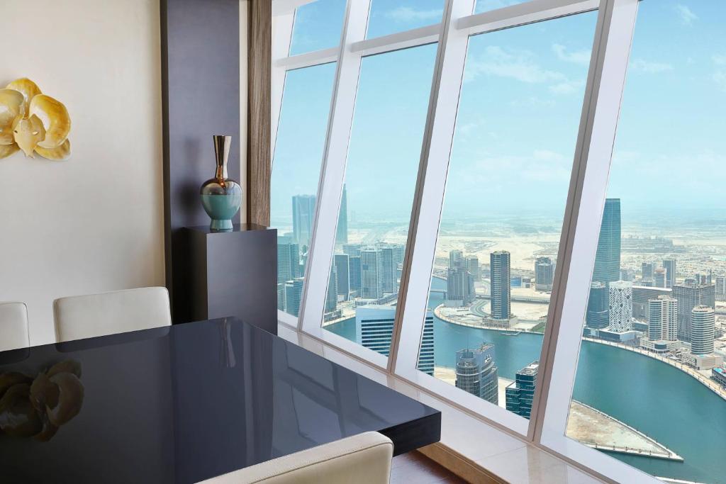 a dining room with a view of the city at JW Marriott Marquis Hotel Dubai in Dubai