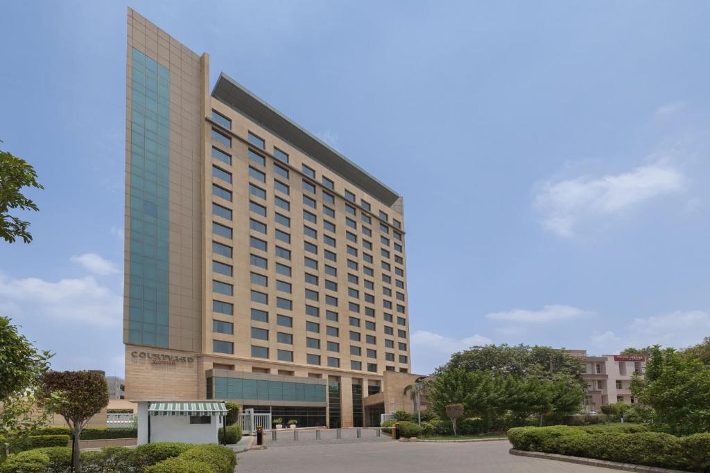 a rendering of the trump international hotel tower from the street at Courtyard by Marriott Gurugram Downtown in Gurgaon