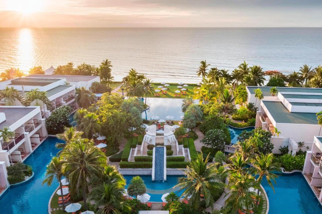 an aerial view of the resort with the ocean in the background at Sheraton Hua Hin Resort & Spa in Cha Am