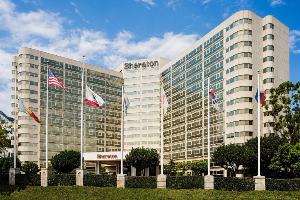 a large building with flags in front of it at Sheraton Gateway Los Angeles Hotel in Los Angeles