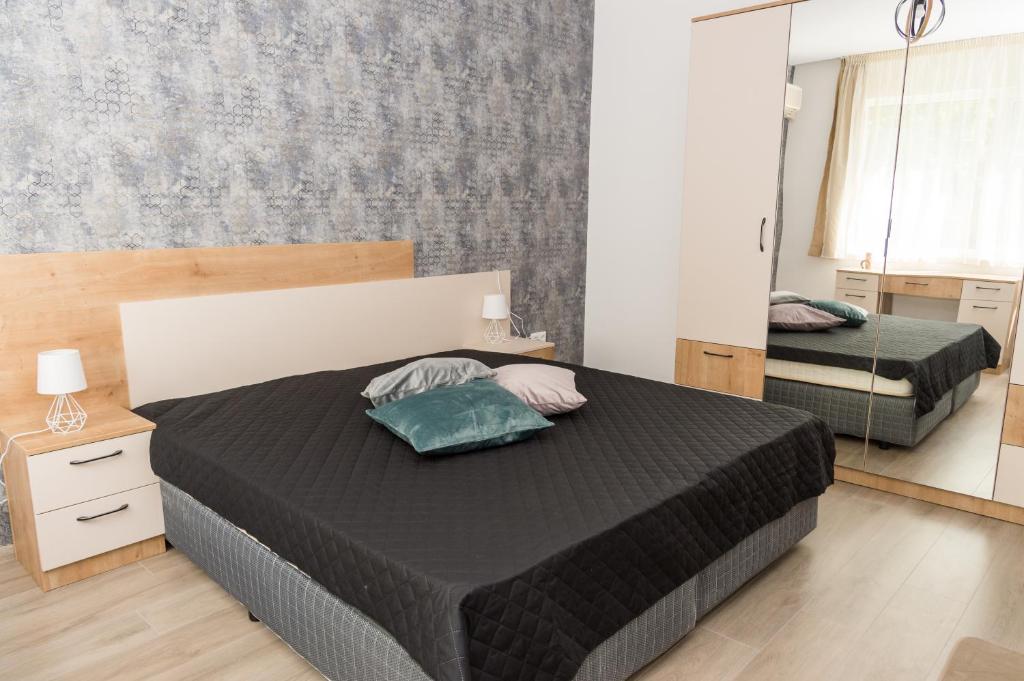 Postel nebo postele na pokoji v ubytování Alagen Apartments Burgas