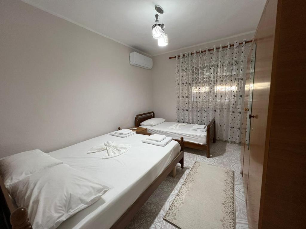 A bed or beds in a room at Home Shkodra Center