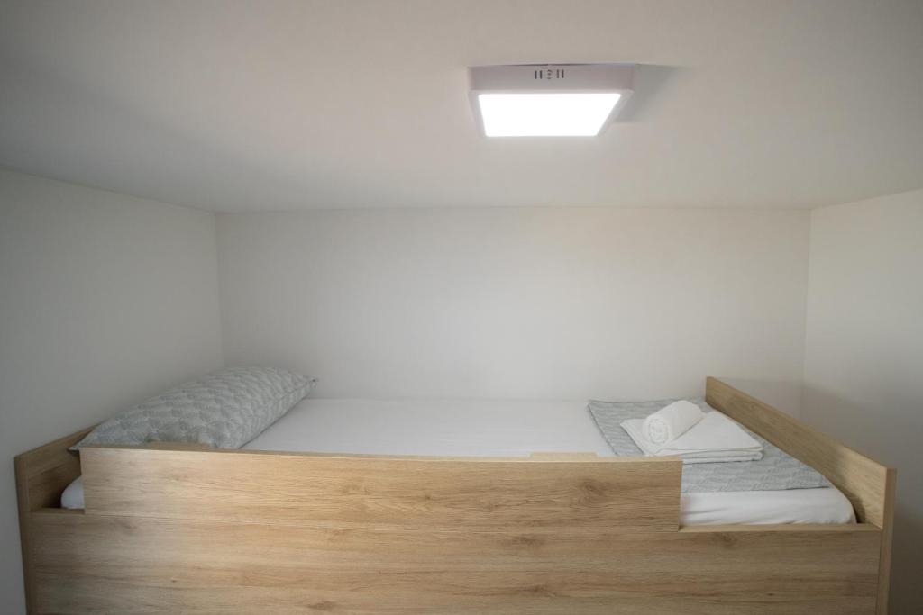 Postel nebo postele na pokoji v ubytování Mobile Home Lana