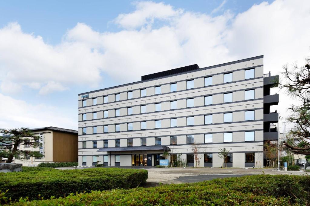 a large white building with a lot of windows at Fairfield by Marriott Kyoto Amanohashidate in Miyazu