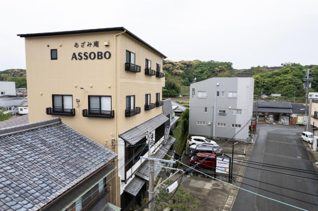 a building with a asoco sign on the side of it at azamianassobo in Asso
