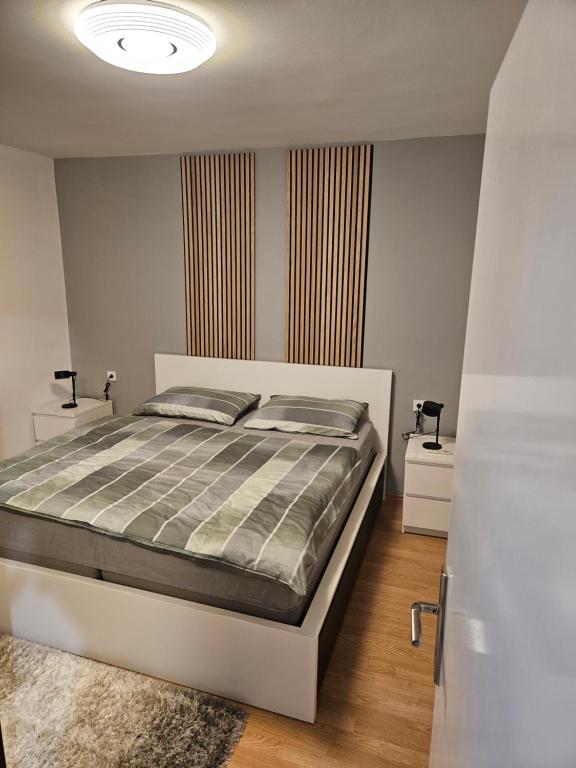 Postel nebo postele na pokoji v ubytování Apartman Cresnar