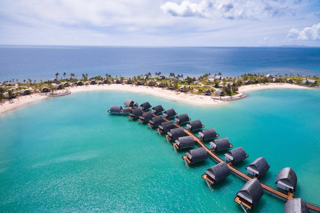 an aerial view of a resort island in the ocean at Fiji Marriott Resort Momi Bay in Momi
