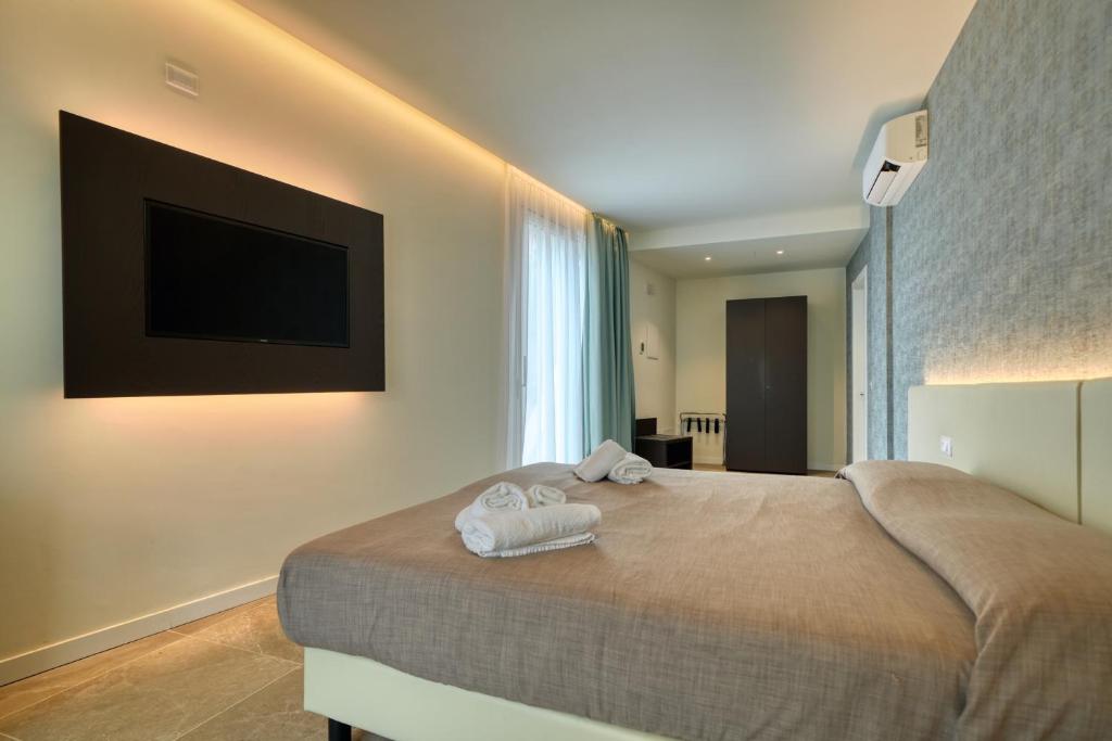 Posteľ alebo postele v izbe v ubytovaní Hotel Palazzo del Garda & Spa
