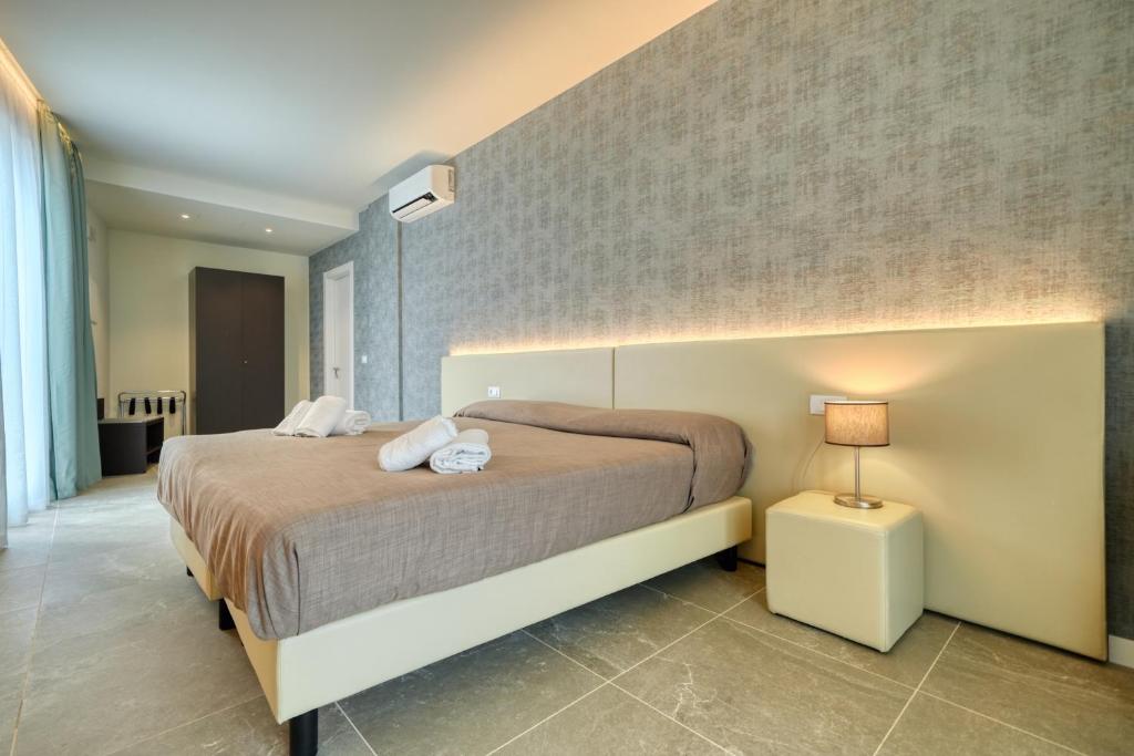 Posteľ alebo postele v izbe v ubytovaní Hotel Palazzo del Garda & Spa