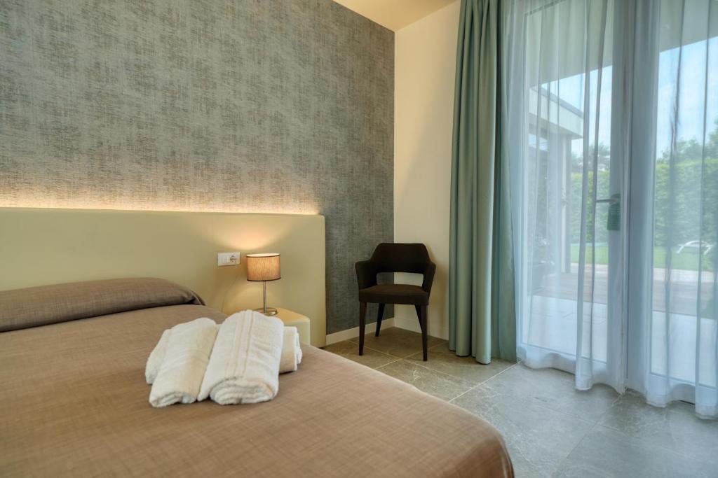 Posteľ alebo postele v izbe v ubytovaní Hotel Palazzo del Garda & Spa