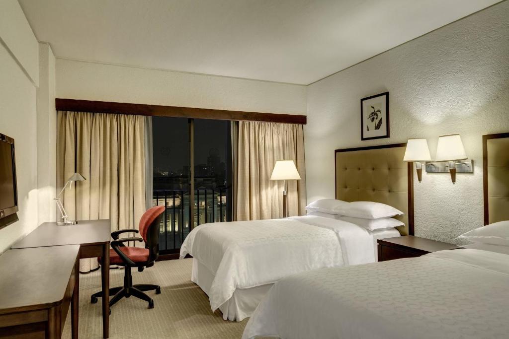 Postel nebo postele na pokoji v ubytování Sheraton Lima Historic Center