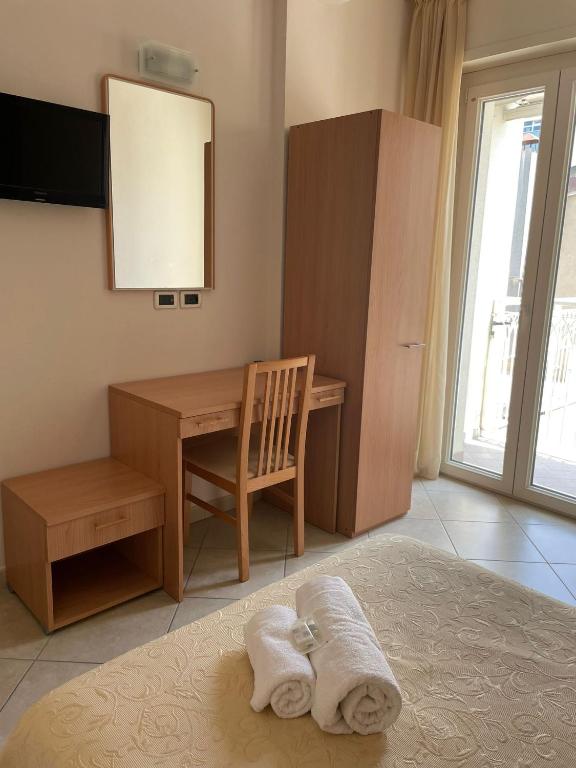 Postel nebo postele na pokoji v ubytování Hotel Favorita
