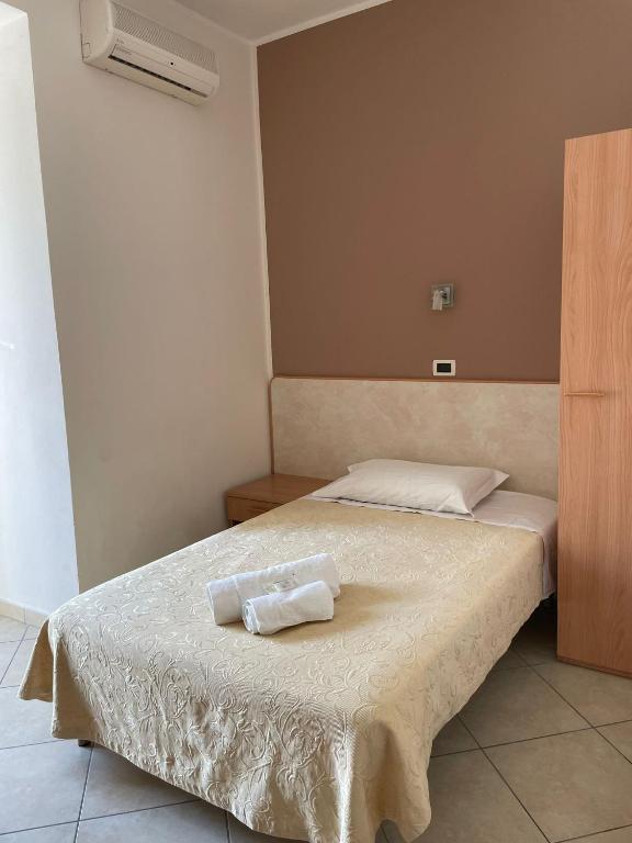 Postel nebo postele na pokoji v ubytování Hotel Favorita
