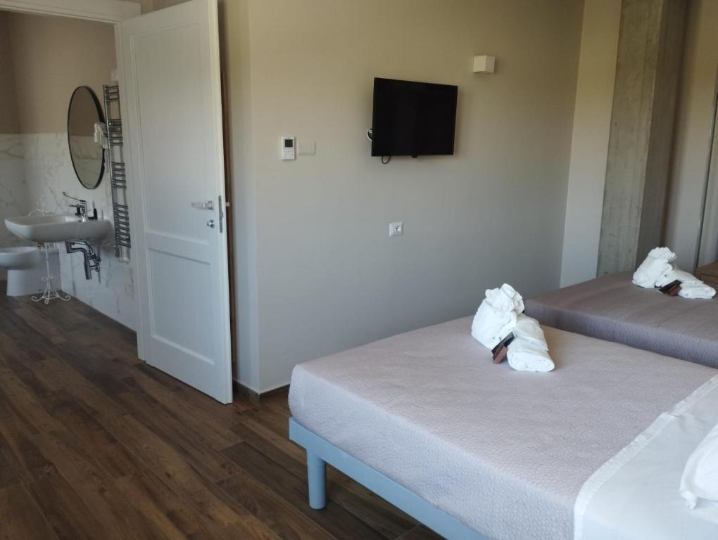 Postel nebo postele na pokoji v ubytování Masseria Spinale Wine Resort