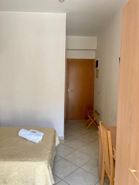 Postel nebo postele na pokoji v ubytování Hotel Favorita