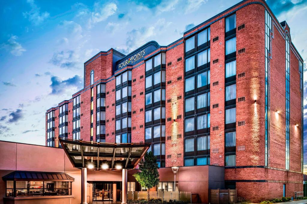 a rendering of a hotel with a brick building at Four Points by Sheraton Mississauga Meadowvale in Mississauga