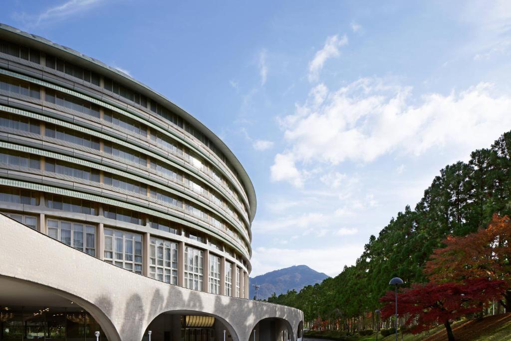 a building with a view of a mountain at The Prince Kyoto Takaragaike, Autograph Collection in Kyoto