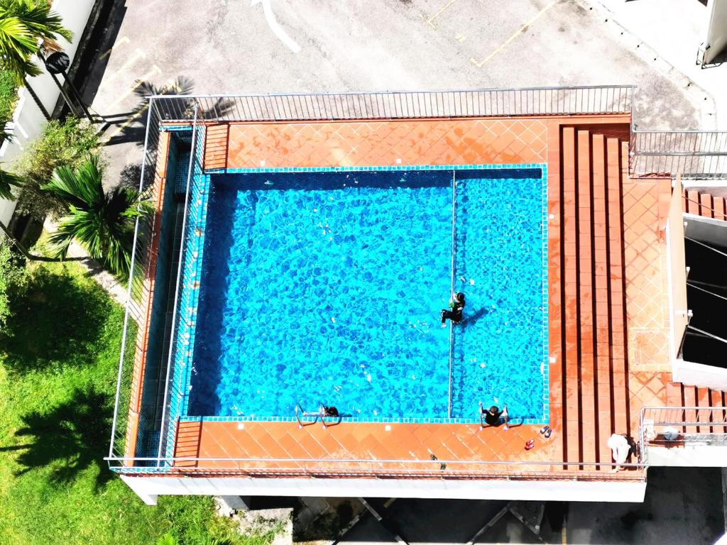 an overhead view of a large swimming pool at TuR10-Oppesite Pisa Stadium-1min-FoodCourt-MiniMarket in Bayan Lepas