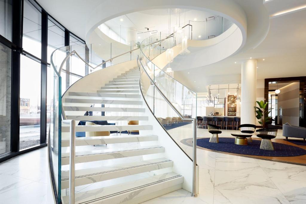 a spiral staircase in a building with a lobby at Courtyard by Marriott Montreal Midtown in Montréal