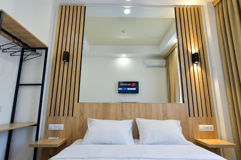Postel nebo postele na pokoji v ubytování Euro Hotel Kutaisi
