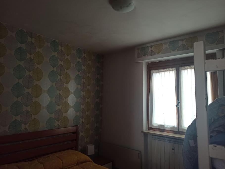 Postel nebo postele na pokoji v ubytování Appartamento spazioso con terrazzo di proprietà