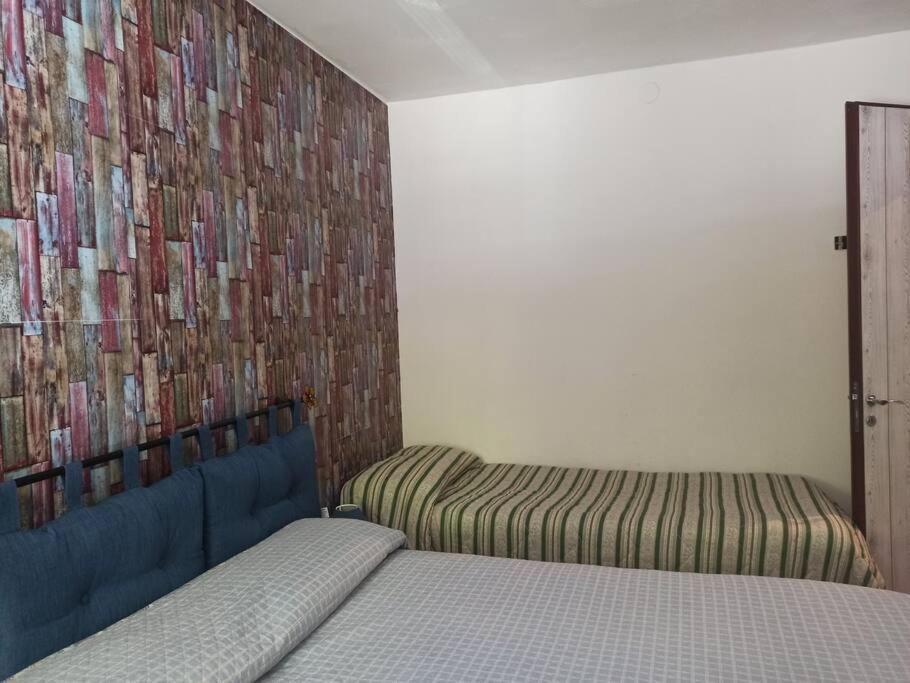 Postel nebo postele na pokoji v ubytování Appartamento spazioso con terrazzo di proprietà