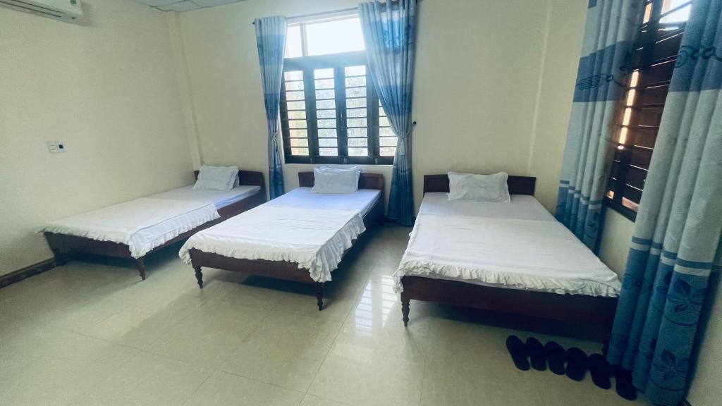 Ένα ή περισσότερα κρεβάτια σε δωμάτιο στο Lâm Đào House