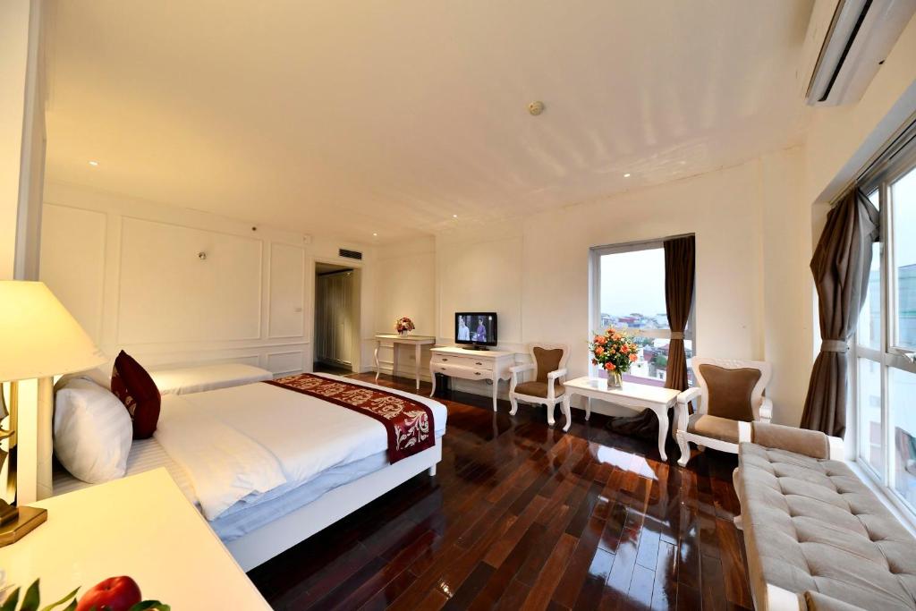 Postel nebo postele na pokoji v ubytování Hanoi Traveller House